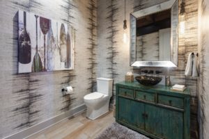 Rustic bathroom with artistic wall decor.