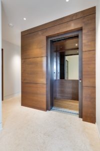 Luxury wooden elevator interior design.