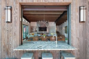 Modern living room view through kitchen window.