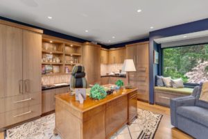 Elegant home office with wooden furniture.