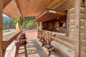 Rustic outdoor wooden bar with forest view