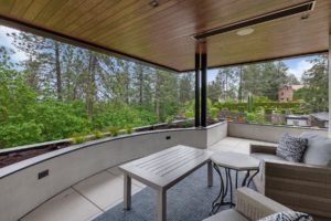 Covered patio with scenic forest view