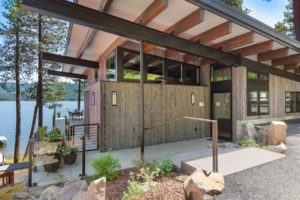 Modern lakeside house with wooden exterior