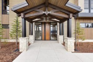 Modern wood and stone house entranceway.