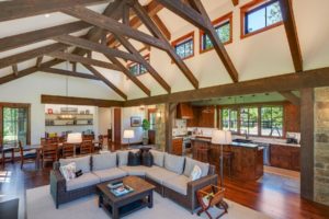 Rustic open living space with exposed beams.