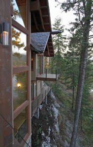Cliffside house with forest view.
