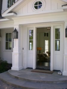 Elegant home entrance with open door.