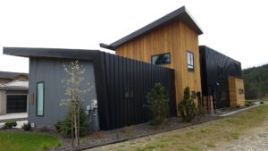 Modern angular house exterior with wood paneling