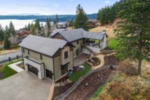 Modern lakeside house with scenic view.