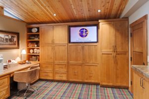 Hayden Lake Country Club Refresh Wooden home office with built-in storage and desk.