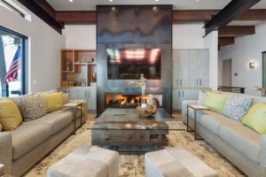 Modern living room with cozy fireplace setting.