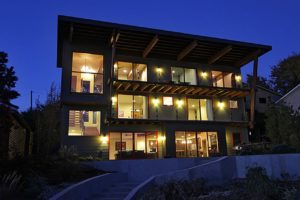 Liberty Lake Residence Modern house illuminated at dusk