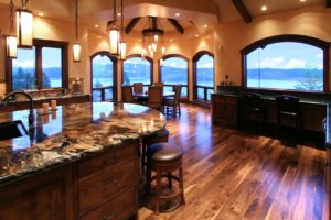 Luxurious kitchen with lake views and elegant lighting.