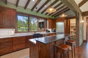 Modern rustic kitchen with wooden beams.
