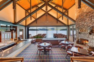 Hayden Lake Country Club Refresh Lakeside restaurant with scenic view and cozy fireplace.