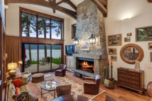 Hayden Lake Chalet Cozy lakeside living room with fireplace.