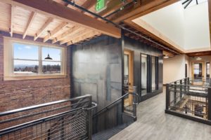 Modern industrial office hallway with metal accents