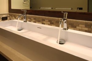 Liberty Lake Residence Modern double faucet sink with water flowing