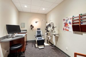 Ellenbecker Eye Clinic Optometrist exam room with diagnostic equipment.