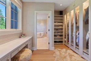 Spacious walk-in closet with bath view
