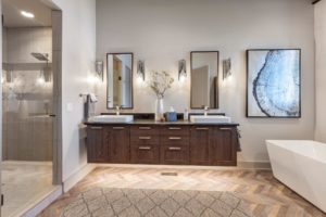 Modern bathroom with twin sinks and elegant decor.