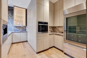 Modern kitchen with sleek cabinetry and appliances.