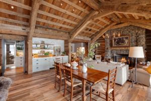 Rustic cabin living room with wooden beams.