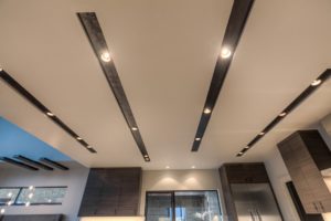 Modern kitchen ceiling with recessed lighting.