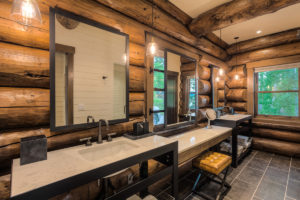 Rustic log cabin bathroom with modern fixtures
