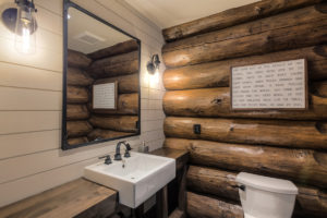 Rustic log cabin bathroom interior design.