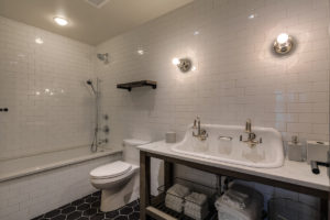 Modern bathroom with white subway tiles.
