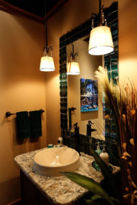 Elegant bathroom vanity with warm lighting.