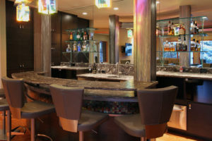 Luxury home bar with modern design and seating