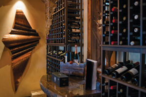 Wine cellar with artistic wall decor.