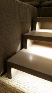 Modern staircase with ambient lighting.