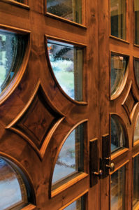 Elegant wooden door with glass panels