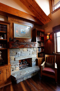 Cozy cabin with stone fireplace and wooden interior