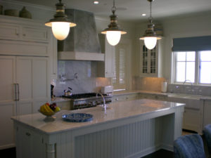 Spacious modern kitchen with marble island.