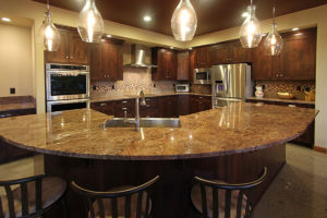 Liberty Lake Residence Elegant modern kitchen with marble countertop.