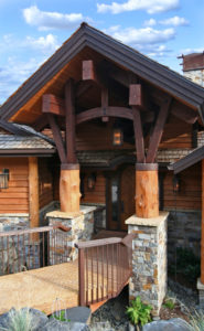Rustic wooden cabin entrance under blue sky