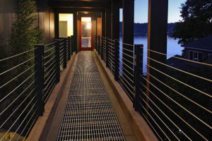 Liberty Lake Residence Elevated walkway with railing at sunset.