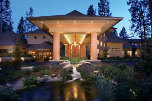 Elegant building entrance with night lighting.
