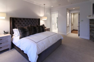 Everwell Bay Remodel Modern bedroom with plush bed and stylish decor.
