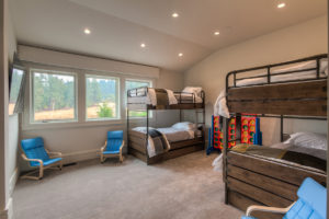 Cozy bunk bed room with mountain view