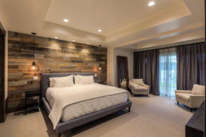 Modern bedroom with rustic wood accent wall