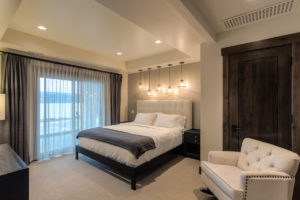 Elegant bedroom with modern lighting.