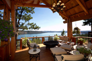 Cozy patio with lake view and lush greenery