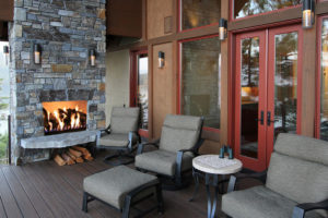Cozy patio with chairs and outdoor fireplace