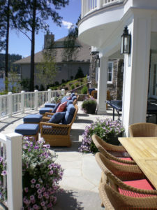 Luxurious patio with wicker seating and flowers