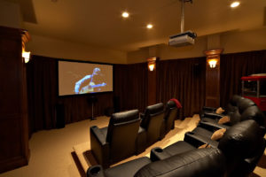 Luxury home theater room with cozy seating.